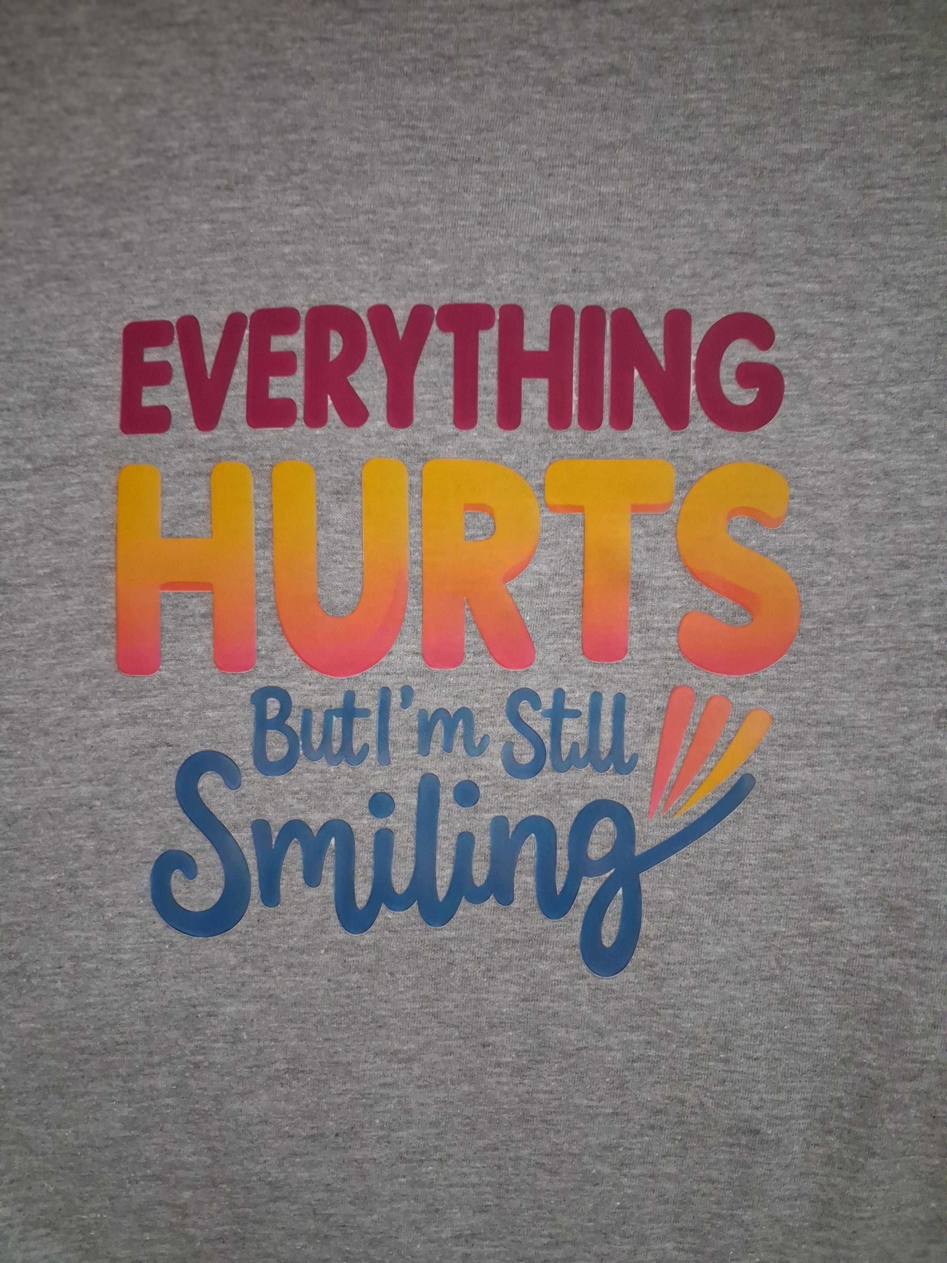 'Everything Hurts But I'm Still Smiling' One-Off Graphic Grey T-Shirt