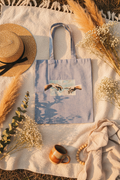 Point the Finger tote bag picnic flat lay